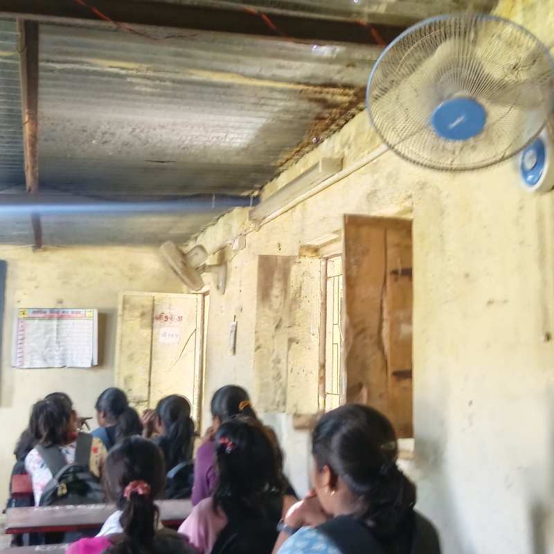 Rural school students learning in classroom which needs restoration