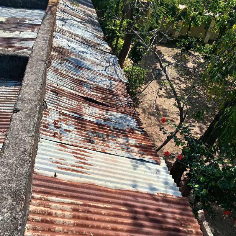 eroded Roofing of classroom prone to water seepage and unhealthy atmosphere